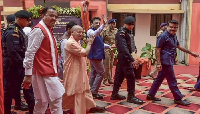 UP CM Yogi Adityanath hands over the keys of 76 flats built on land seized from slain mafia Atiq Ahmed