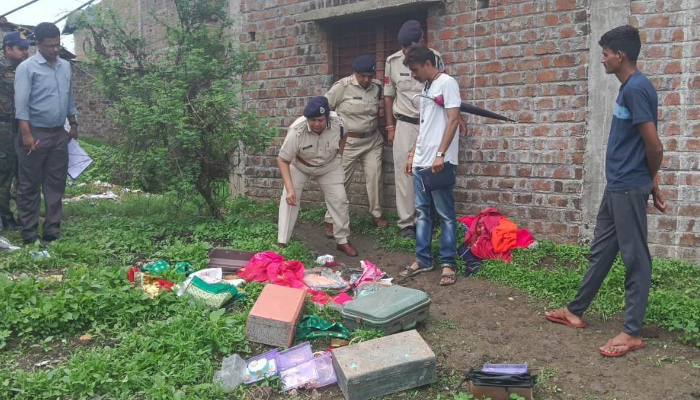 Police at the deceased Bana Singh's home.