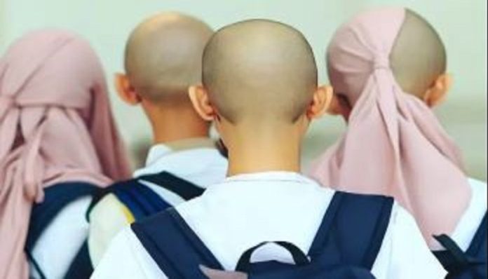 A teacher in Indonesia partially shaved off heads of 14 girls over Islamic dress code