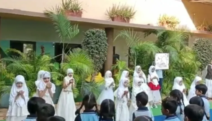 Little girls performing in the hijab.