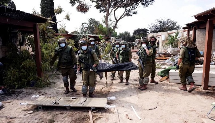 ‘It is not a battlefield, it is a massacre’: Hamas killed entire families, including babies in Kibbutz Kfar Aza in Israel, reports say some were beheaded
