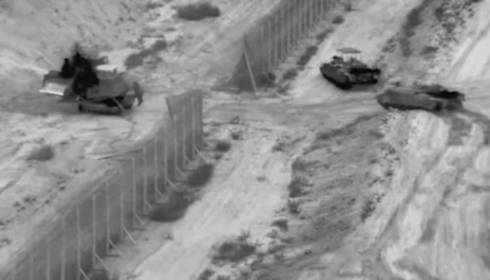 Israeli troops and tanks launch a brief raid into the Gaza Strip ahead of the full-scale ground offensive