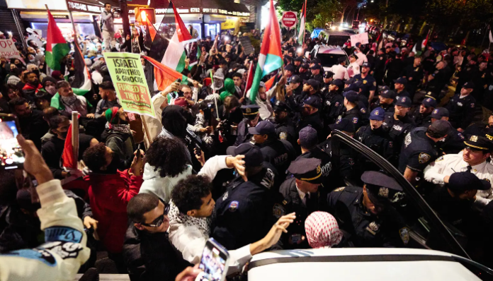 The protesters are seen faced off with NYPD cops during the anti-Israel rally.