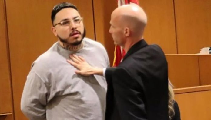Stepfather hits stepdaughter's killer in court