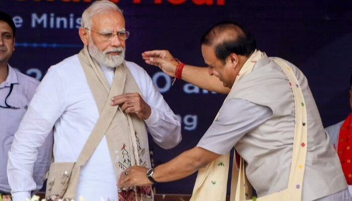 Prime Minister Narendra Modi gets felicitated by Chief Minister of Assam, Himanta Biswa Sarma.