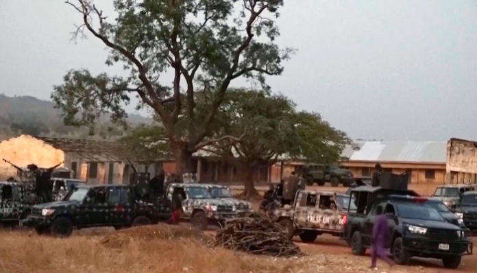 Vehicles belonging to the Nigerian army positioned near the Kuriga school where the students were abducted.
