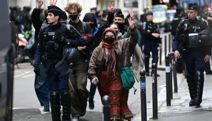 Student protesters were escorted out of the Sciences Po building by authorities.