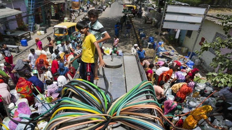 Amidst soaring heat, water shortage continues in Delhi, residents scramble after water tankers with empty buckets