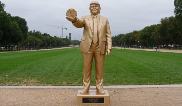 Giant golden statue of Donald Trump holding a Bitcoin installed outside US Capitol by cryptocurrency investors