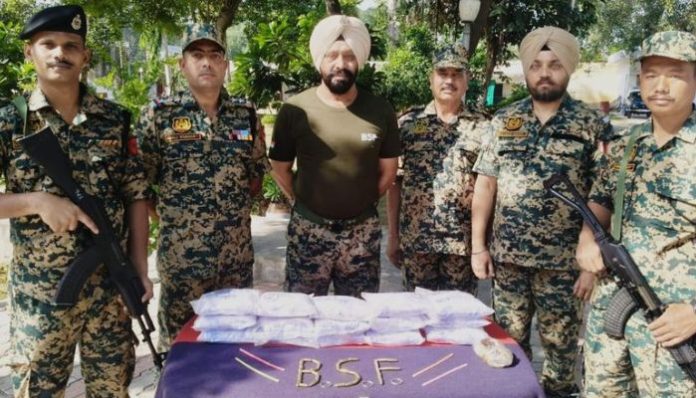 BSF personnel patrol India-Pakistan border in Punjab to prevent drug smuggling and cross-border intrusions.