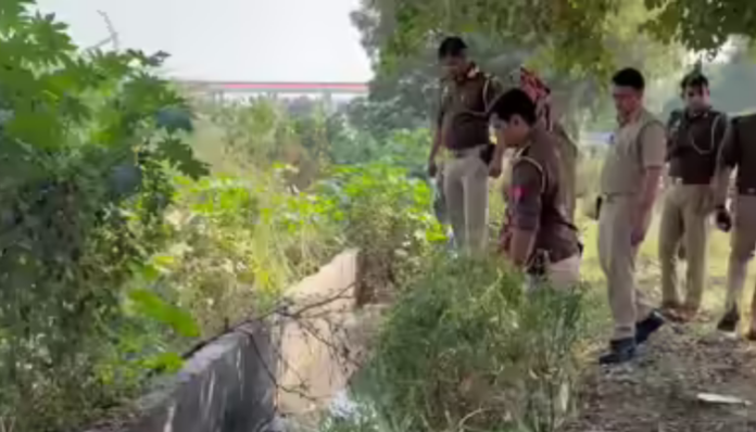 A headless body of an unidentified woman as found in a drain in Noida.