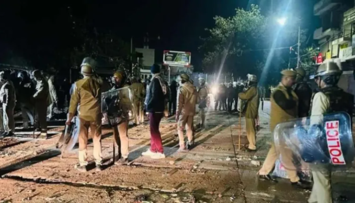 When police were trying to remove stones from outside a mosque in Chomu, a Muslim mob flung stones at them.