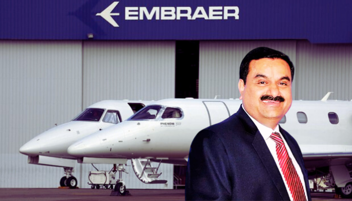 Adani Group ties up with Embraer to make planes in India.