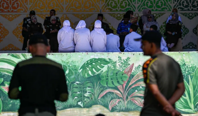 Indonesia: Sharia police holds public caning event, young lovers caned 140 times for alcohol and sex