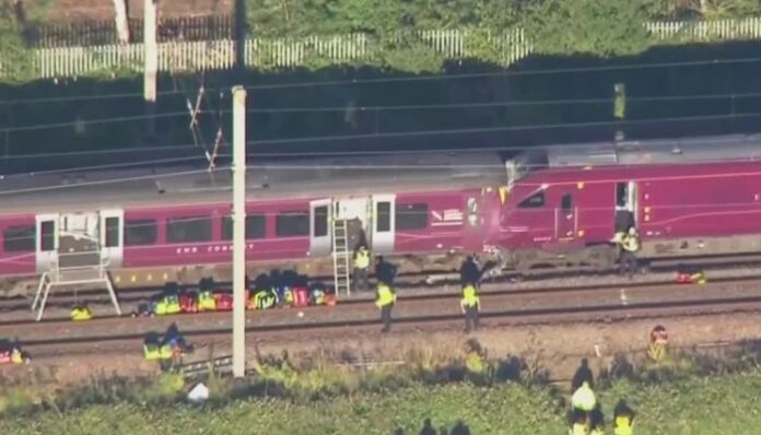 A train collision near Bedford, north of London, left one train driver dead and dozens of passengers injured on Friday evening.