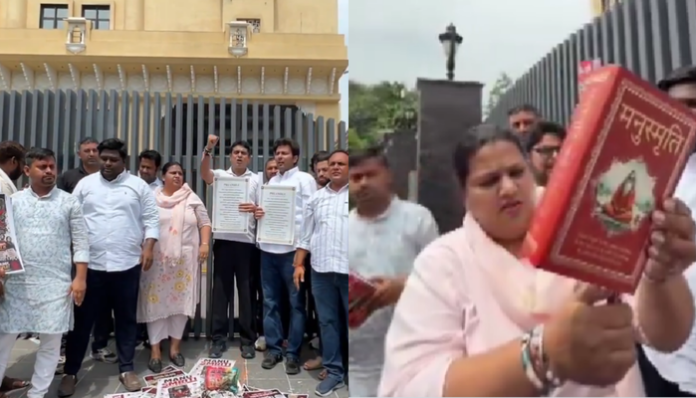 Indian Youth Congress workers burnt Manusmriti outside RSS headquarters in Delhi.