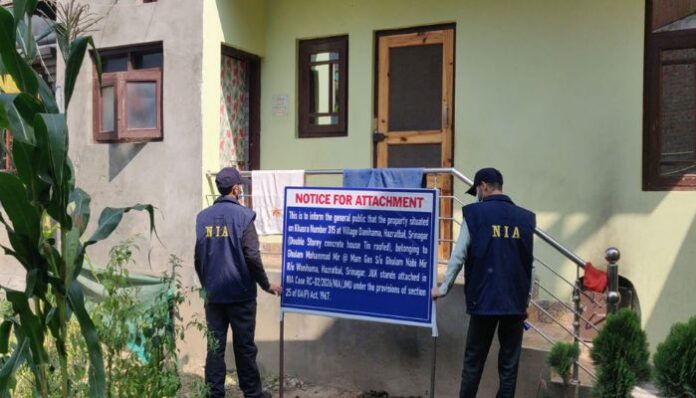 The NIA has attached a residential property in Srinagar under the UAPA in a case involving an cross-border terror conspiracy.