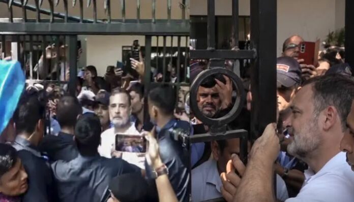 Congress MP Rahul Gandhi and supporters barge into Akashvani Bhawan even as a security guard stops them during protest against CEC Gyanesh Kumar 